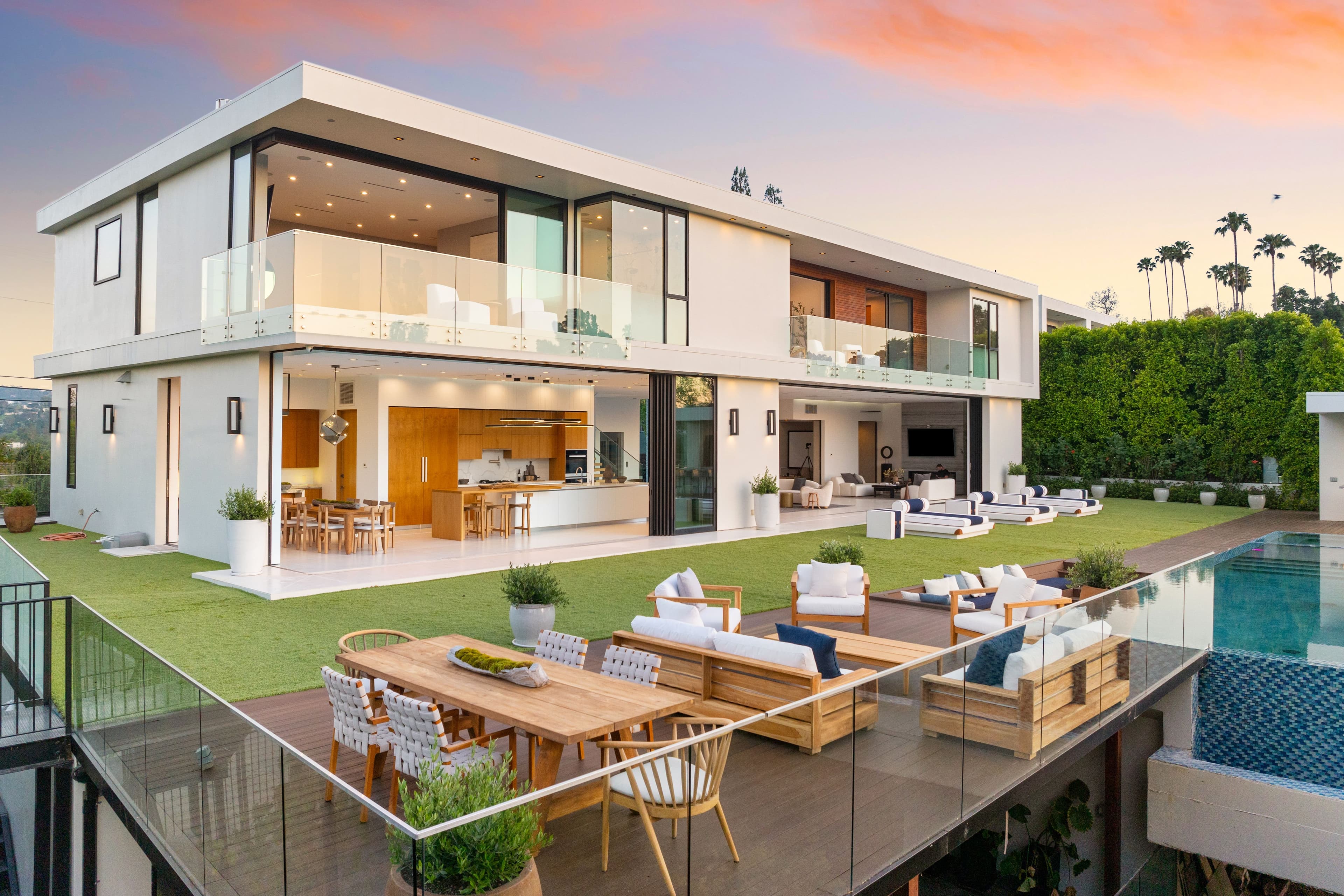Luxurious home patio with outdoor pool and glass doors
